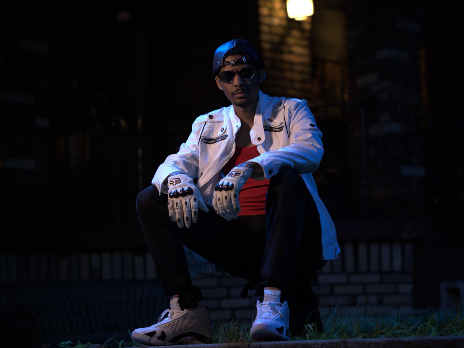 Carleton King night street portrait in white jacket